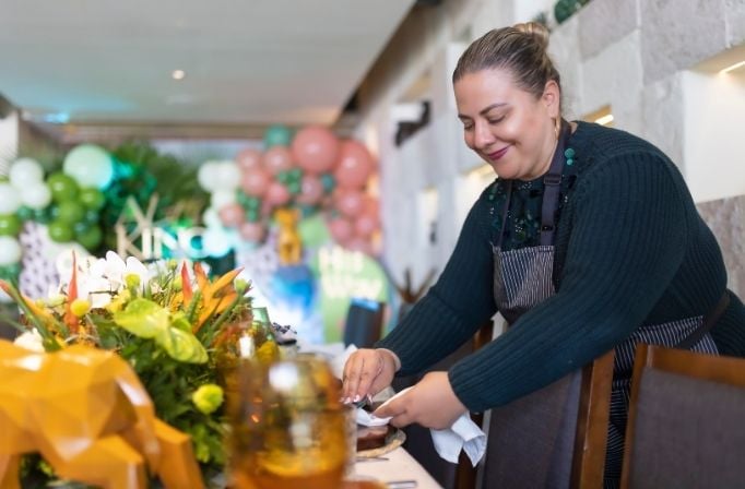 Caterer preparing table